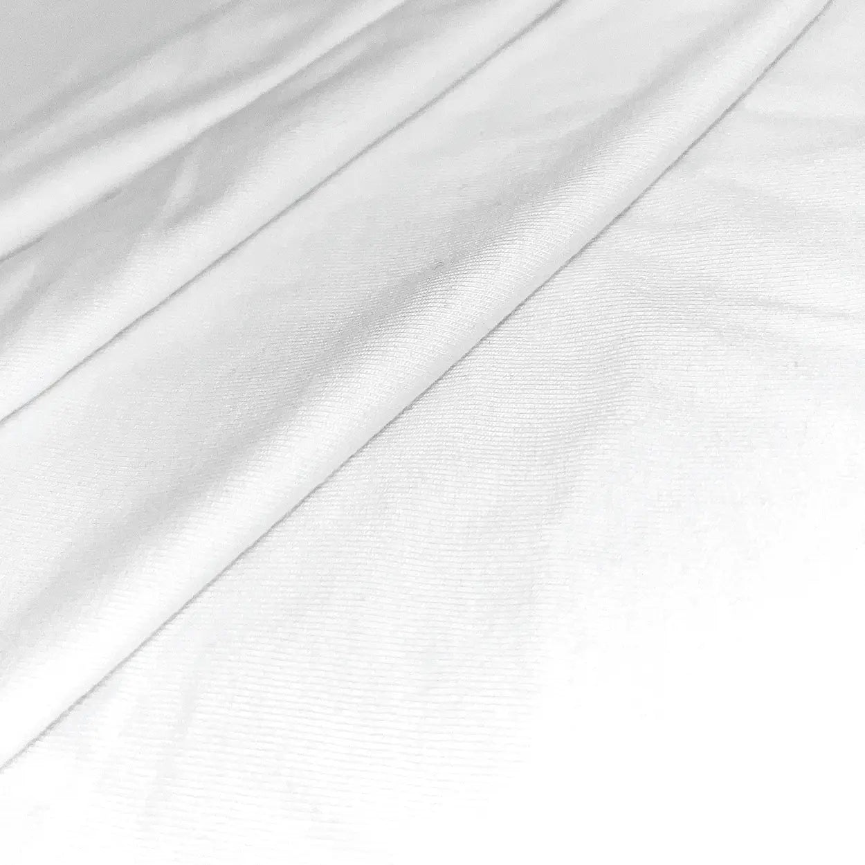 Close-up of Zenboo's CloudZen bamboo fabric in white, showcasing its soft texture and breathable, eco-friendly material.